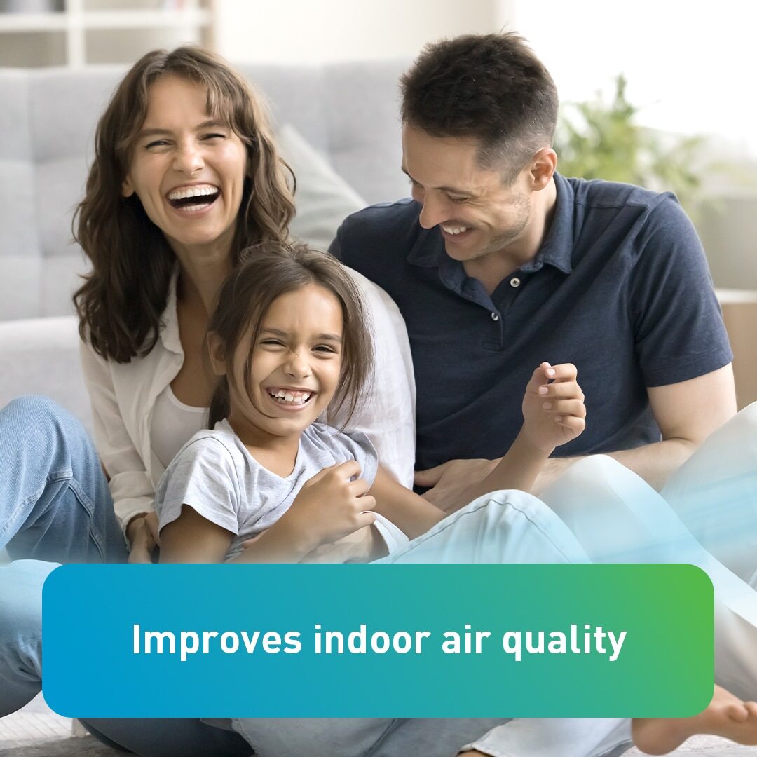 Smiling family sitting together with text overlay- Improves indoor air quality
