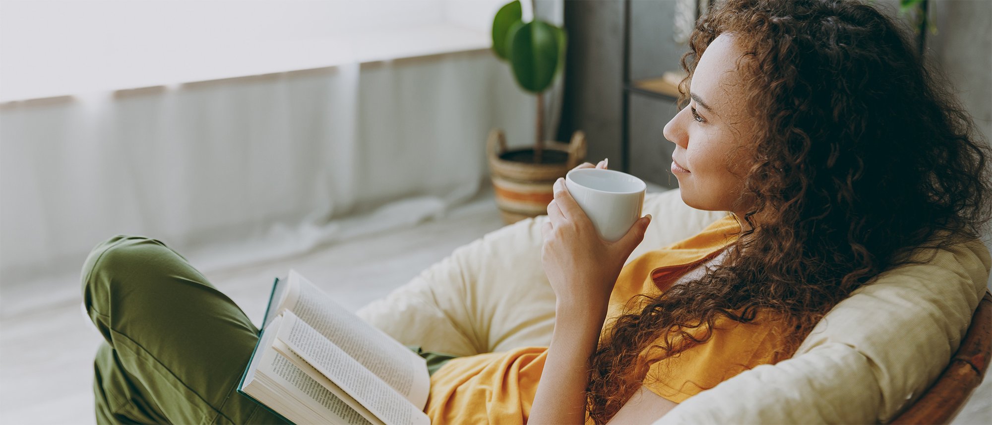 Woman drinking coffee breathing clean air